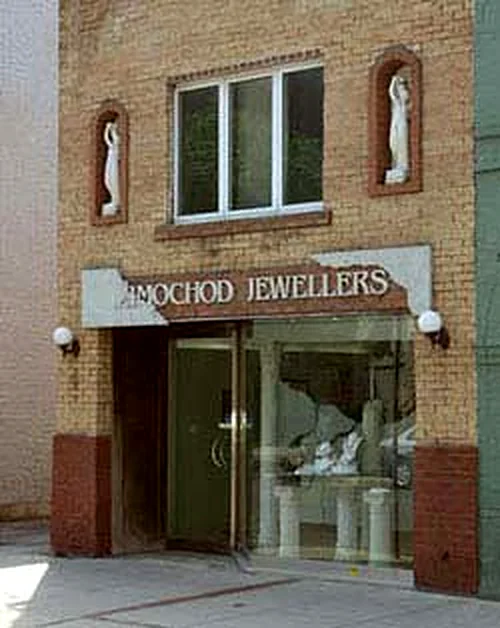 The Zimochod Jewellers storefront on Quebec Street, in a brick building with arched niches