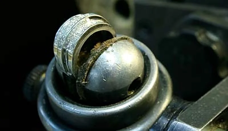 A ring held in a setter's ball vice in the workshop